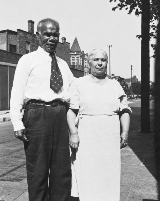 Black-and-white photograph of Salvatore and Calogera on a city sidewalk in Chicago in the 1950s.